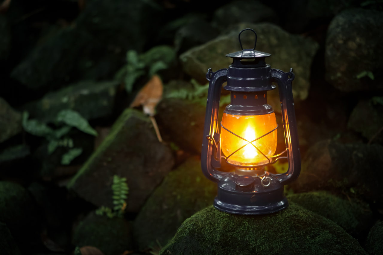 Storm lanterns on mossy rocks